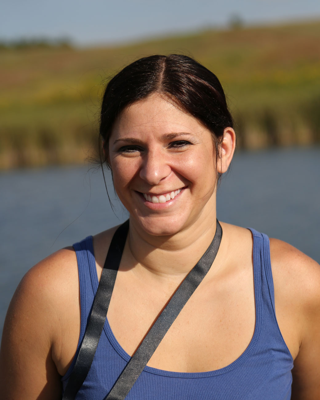 Photograph of artist Courtney Kolander at Wolf Lake Wetlands Prairie.