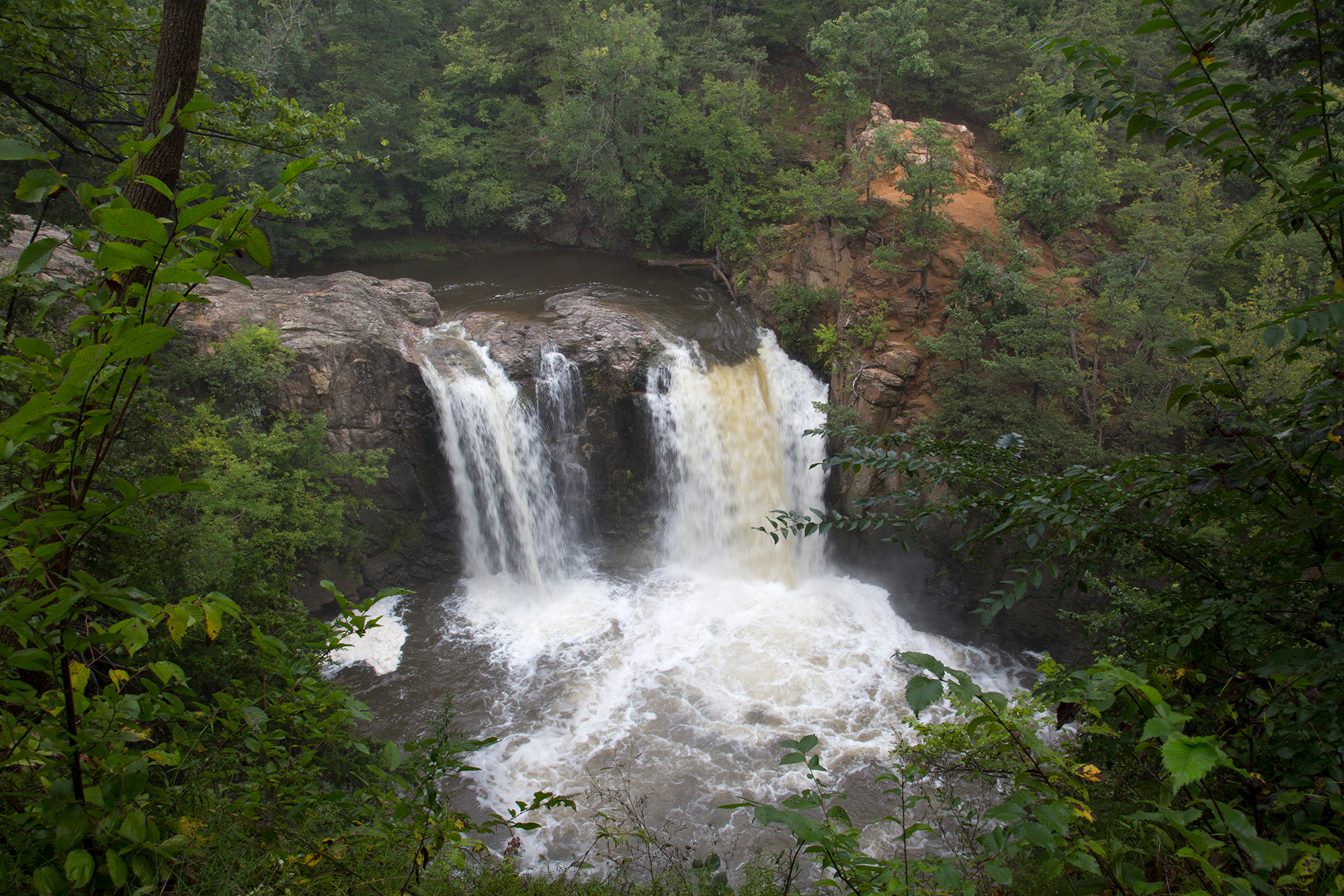 Ramsey Park Redwood Falls 13 The rushing waterfalls at Ramsey park on a cloudy day with lot of green trees.